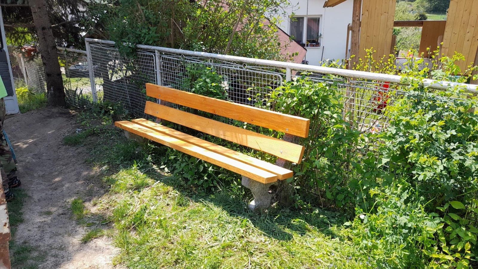Repaired bench by a fence in Krásna Ves