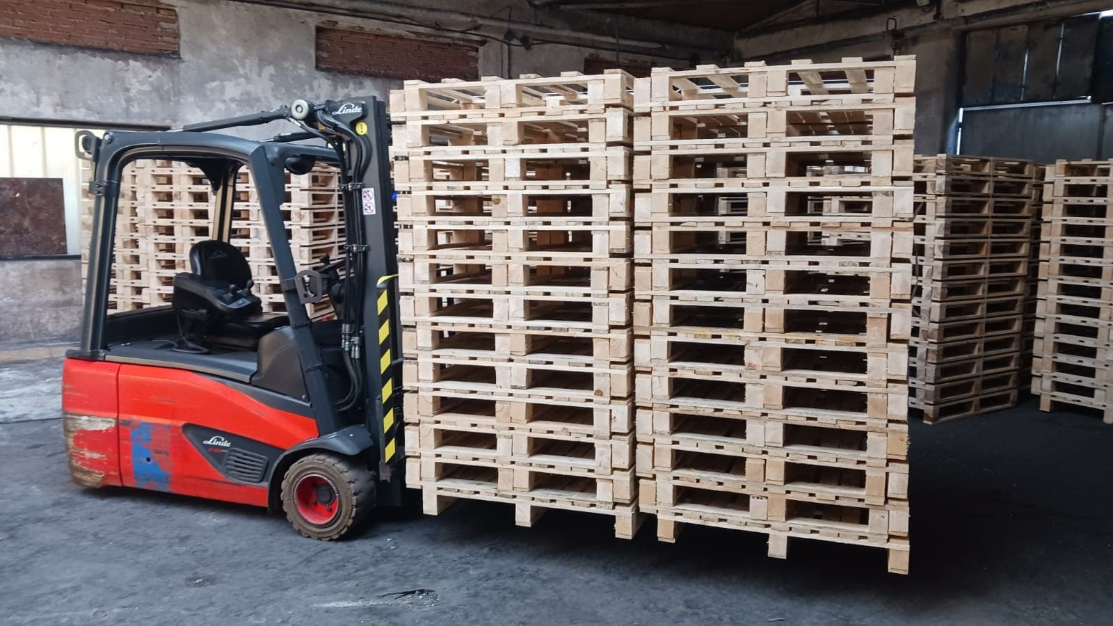 Lightweight pallets being loaded by forklift truck